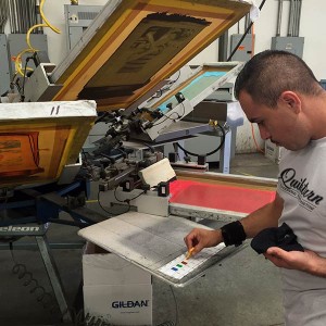 Our sample screenprinting artist setting up a new sample print.